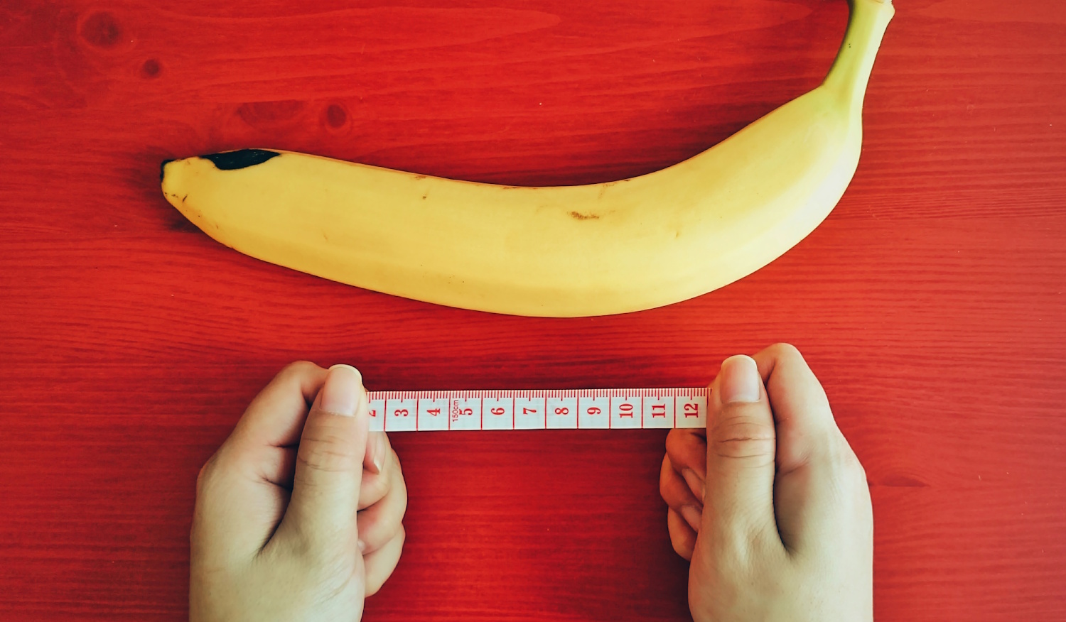 banán, centimétert fogó kéz