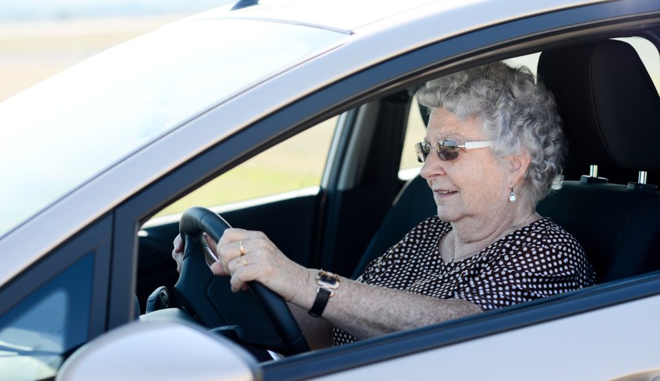 happy cheerful elderly senior woman driving her car | Meglepetés idős nő autót vezet